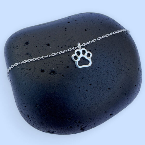 Exquisite silver anklet with a dog's pawprint charm.