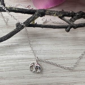 Cute sterling silver elephant charm on a silver ankle bracelet.