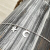 Sterling silver ankle bracelet with a dainty star and crescent moon charm.