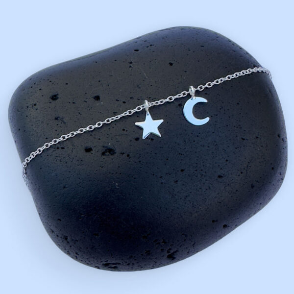 Celestial anklet with a silver star and a crescent moon charm.