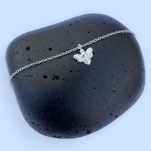Nature's warrior anklet with silver charm attached of a bee.