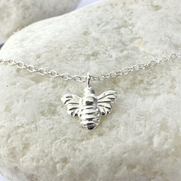 Sweet silver anklet with pendant attached of a bee.