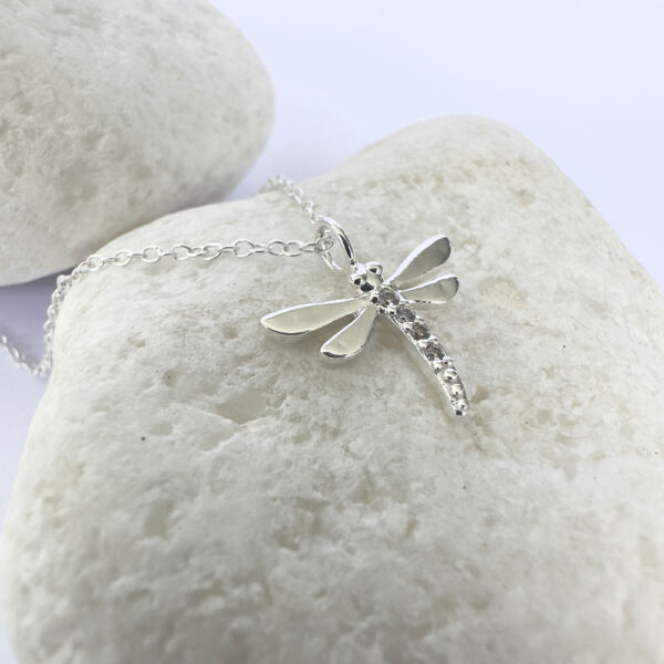 Stunning silver anklet of a dragonfly with cubic zirconia stones detail.