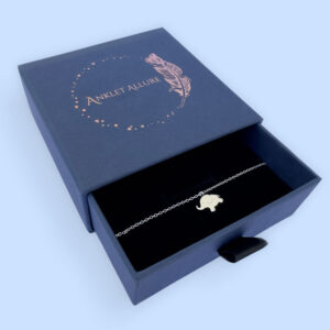 Children's anklet with cute solid silver elephant charm. presented in a blue jewellery box with Anklet Allure written on the top in rose gold.