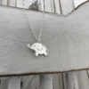 Cute sterling silver elephant charm on a silver ankle bracelet.
