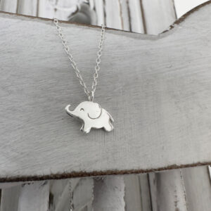 Cute sterling silver elephant charm on a silver ankle bracelet.