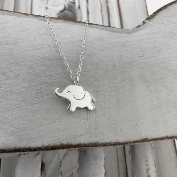 Cute sterling silver elephant charm on a silver ankle bracelet.