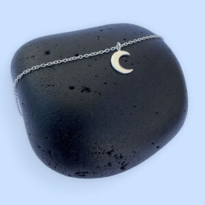 Stunning silver anklet with a crescent moon charm.