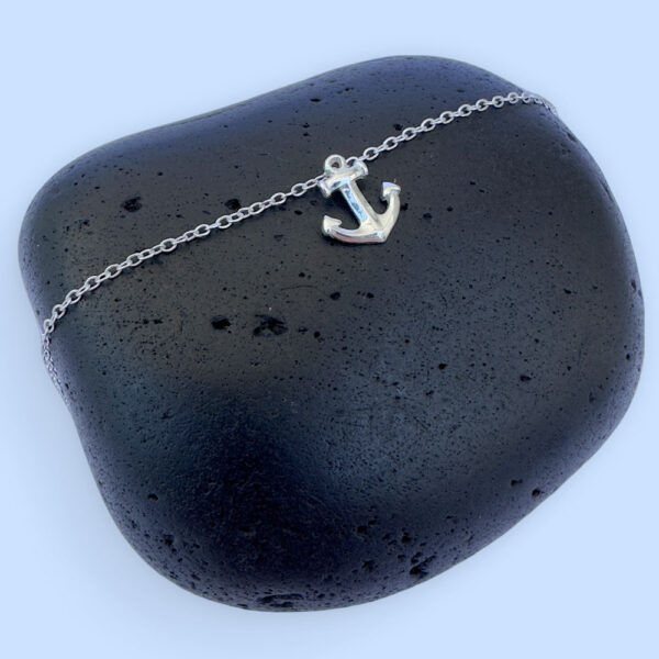 Sterling silver anklet with a silver anchor charm.