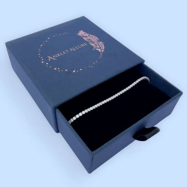 Sparkly simple anklet presented in a blue jewellery box.