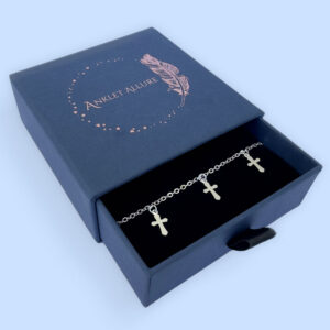 Silver anklet with three silver crosses equally spaced around the chain presented in a blue Anklet Allure jewellery box.