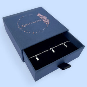 Three tulips on a silver anklet presented in a pretty blue Anklet Allure jewellery box.