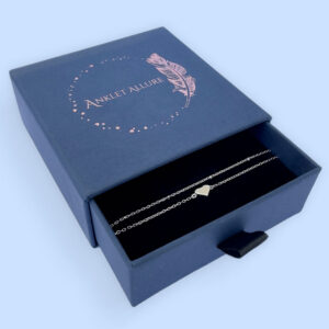 Double chain silver anklet with solid silver heart presented in a dark blue Anklet Allure gift box.