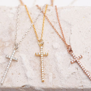 Three crosses anklets in silver, gold and rose gold with cubic zirconia detail.