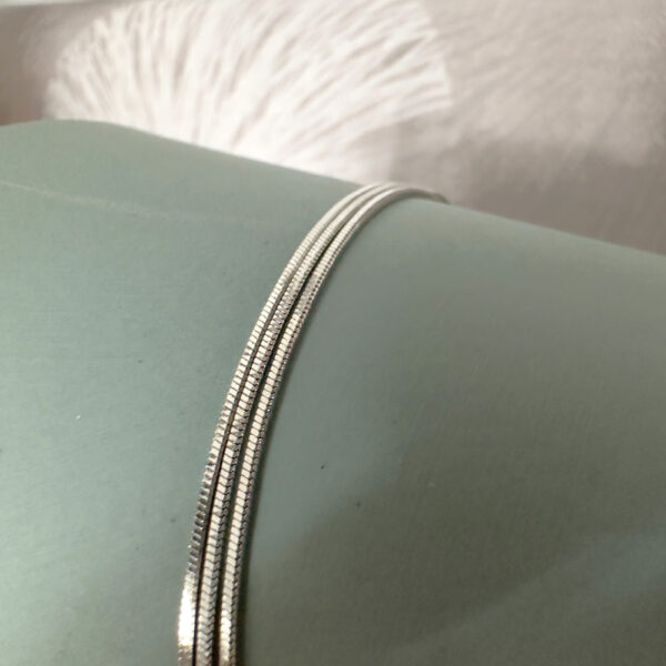 Triple chain shiny sterling silver anklet.