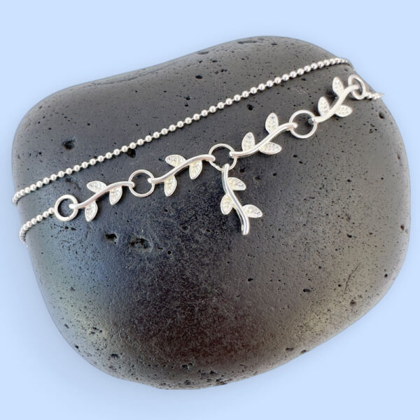 Double chain silver anklet with a beautiful branch and leaf section to the chain.