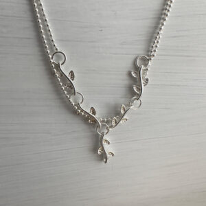 Sterling silver double chain anklet with a solid silver interlinked plant roots feature.