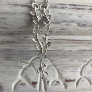Sterling silver anklet with a solid silver roots feature interlinked on a dainty double chain.