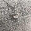 Shiny sterling silver pencil chain with royal crown charm with cubic zirconia detail