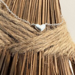 Simple sterling silver anklet with silver heart charm.