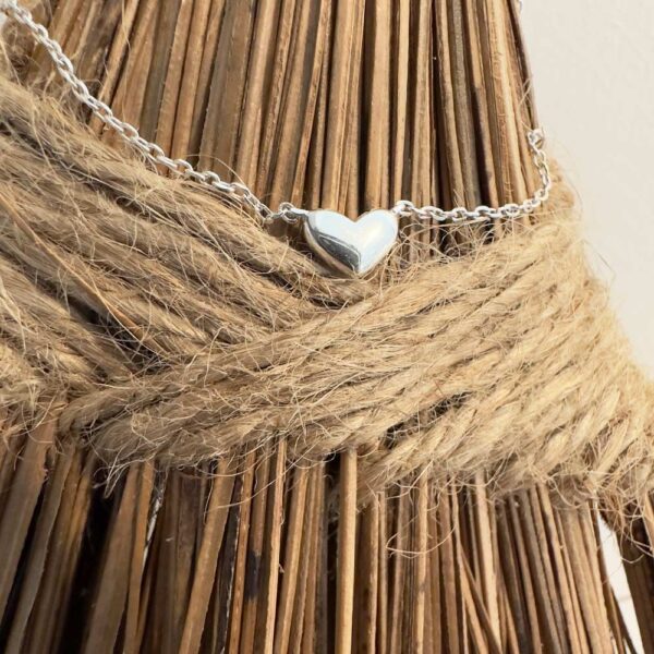 Simple sterling silver anklet with silver heart charm.