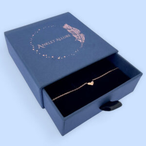 Stunning rose gold anklet with a cute solid rose gold heart charm in a blue Anklet Allure jewellery box.