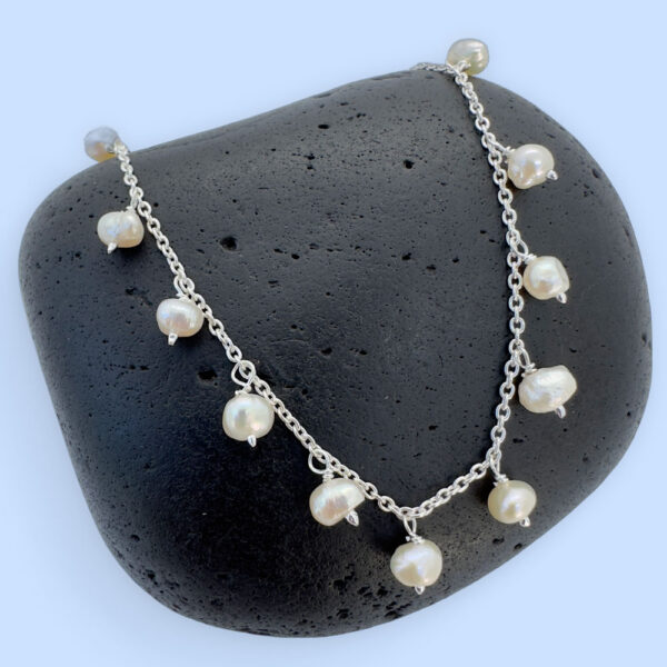 Stunning anklet with freshwater pearls hanging all the way around.