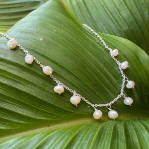 An anklet fit for a princess, made up of elegant freshwater pearls spaced equally around the chain.