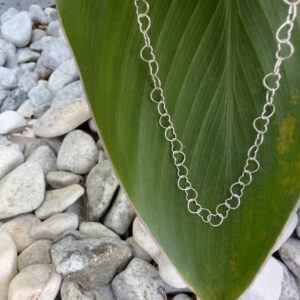 Cute anklet made up of identical sterling silver interlinked hearts.
