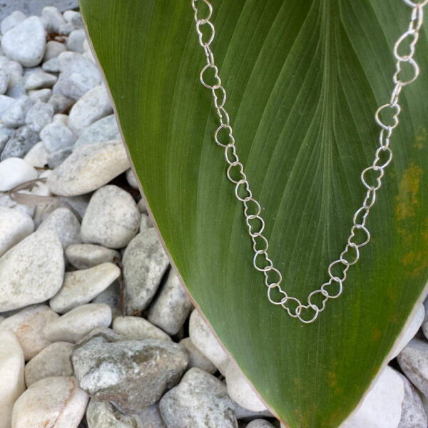 Cute anklet made up of identical sterling silver interlinked hearts.